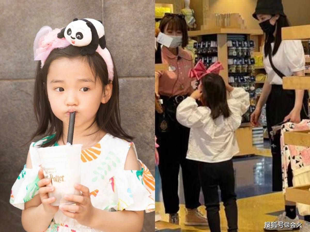 双手41岁董璇带女儿走机场！穿露腰短上衣不怕冷，被女儿环抱好亲密