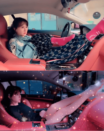 穿着牛仔上衣和印花长裤,直接将套着红袜子的脚搭在方向盘上,姿势嚣张