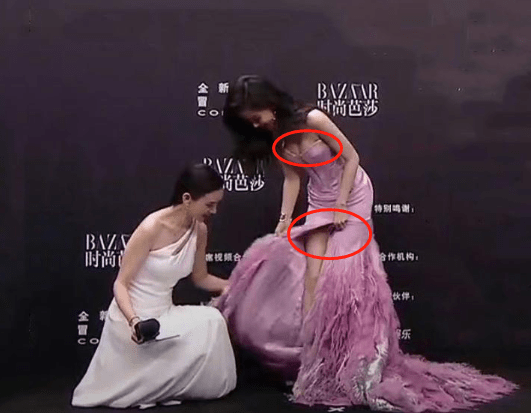 整理期间为了遮挡高时尚避免展露,杨颖赶紧弯腰捂住高时尚的地方,前