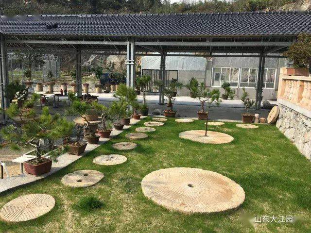 古旧磨盘在园林景观中的应用