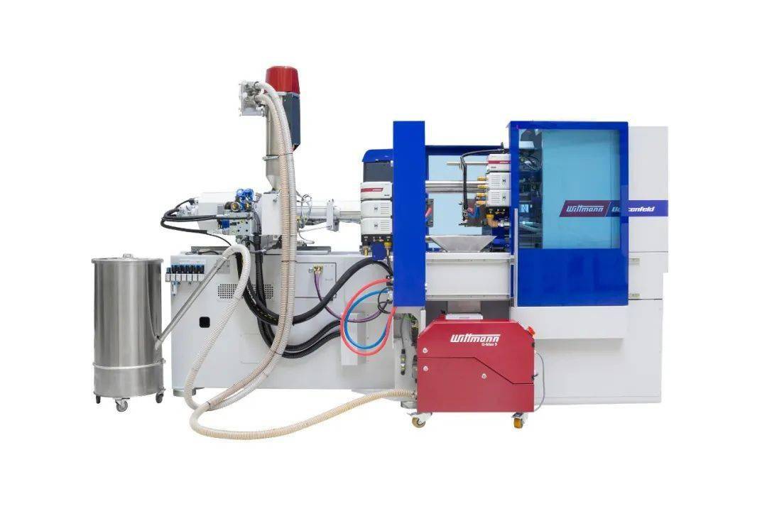 在ingrinder生产单元上,一台带有可旋式驱动的威猛斜臂式机械手在注塑